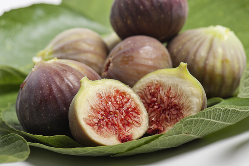 bunch of ripe figs on foliage